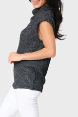 Side of woman modeling Cap Sleeve Funnel Neck Top in Black styled business casual