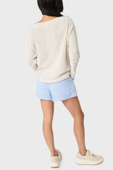 Back view of Woman modeling Favorite Summer Short in Chambray Herringbone styled with casual sweater