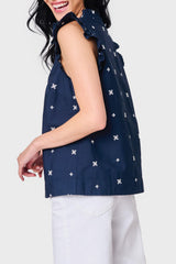 Side view of Woman modeling Decked Out Day Top in Navy Embroidered styled with casual pants