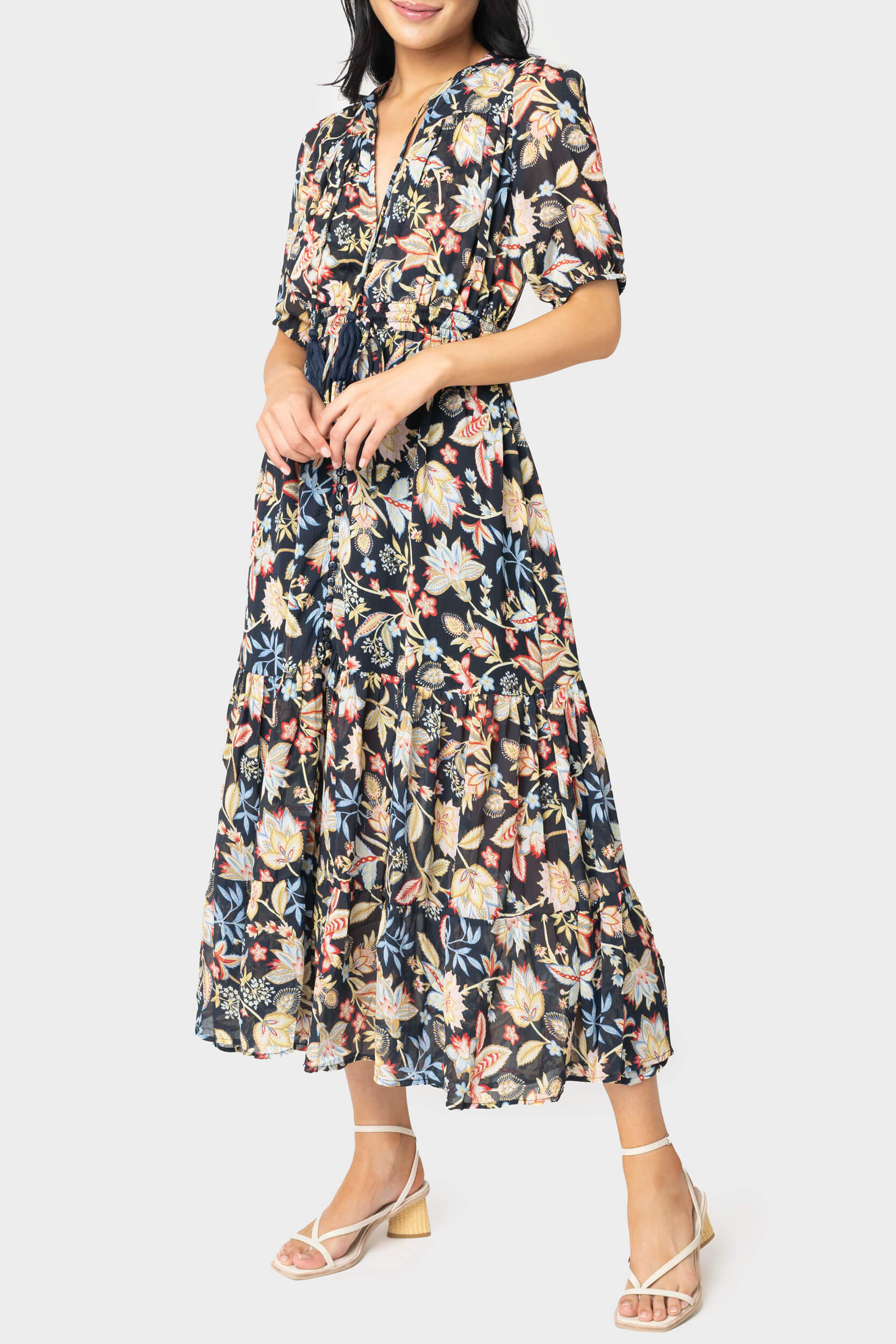 Front of women wearing the Elan Short Sleeve Tiered Floral Midi Dress in navy melrose print