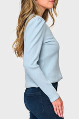 Side of Woman modeling The Amelia Ribbed Henley Top in light Blue Fog, styled everyday casual