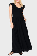 Woman modeling Flutter Sleeve Smocked V-Neck Tiered Maxi Dress in Black, styled for work