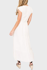 Woman modeling Flutter Sleeve Smocked V-Neck Tiered Maxi Dress in Off White styled for work