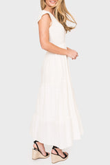 Side of Woman modeling Flutter Sleeve Smocked V-Neck Tiered Maxi Dress in Off White styled summer business casual