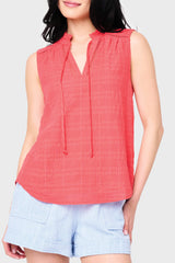 Woman modeling Cameron Day Top with Crochet Trim in Hibiscus red styled with weekend casual shorts