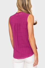 Back view of Woman modeling Cameron Day Top with Crochet Trim in Neon Berry styled with casual pants