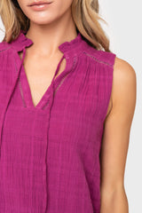 Woman modeling Cameron Day Top with Crochet Trim in Neon Berry ruffle split neck detail