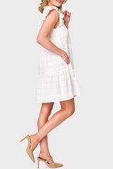 Side view of Woman modeling Flutter Sleeve Decked Out Day Dress in White styled for summer weekend