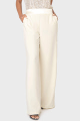 Woman modeling Solstice Satin Trim Pant in Ivory styled business casual for holiday event