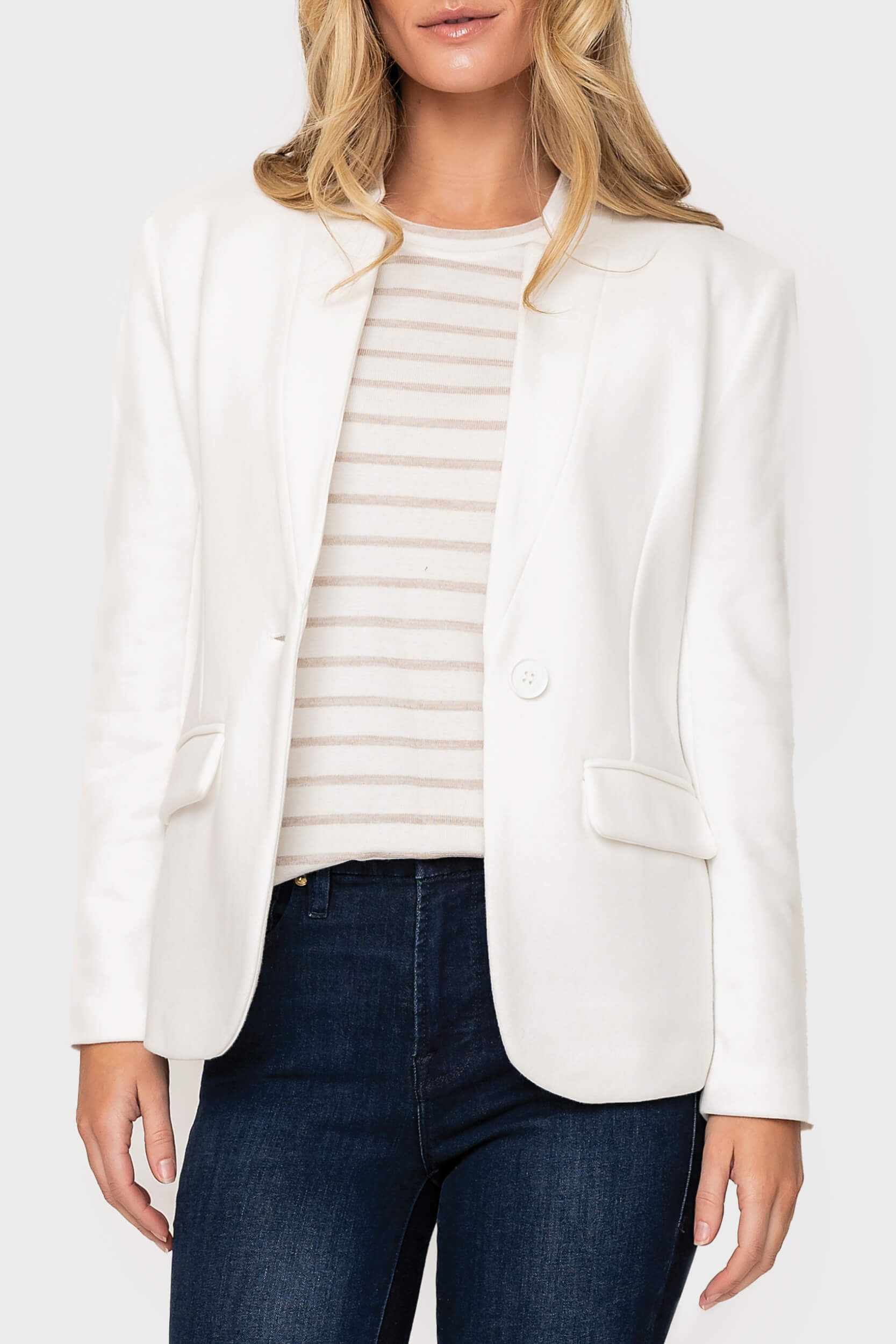 Woman modeling Notch Collar Blazer in White styled business casual for work