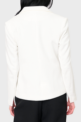 Back of Woman modeling Double Breasted Knit Blazer in White styled for work