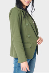 Side of women wearing double breasted blazer in green