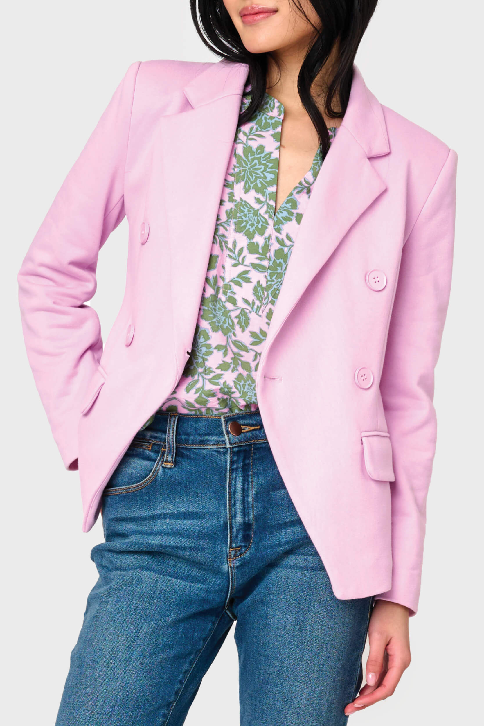 Woman modeling Double Breasted Knit Blazer in Pirouette pink styled for the office