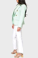 Side of woman modeling Double Breasted Knit Blazer in Surf Spray mint green styled for summer