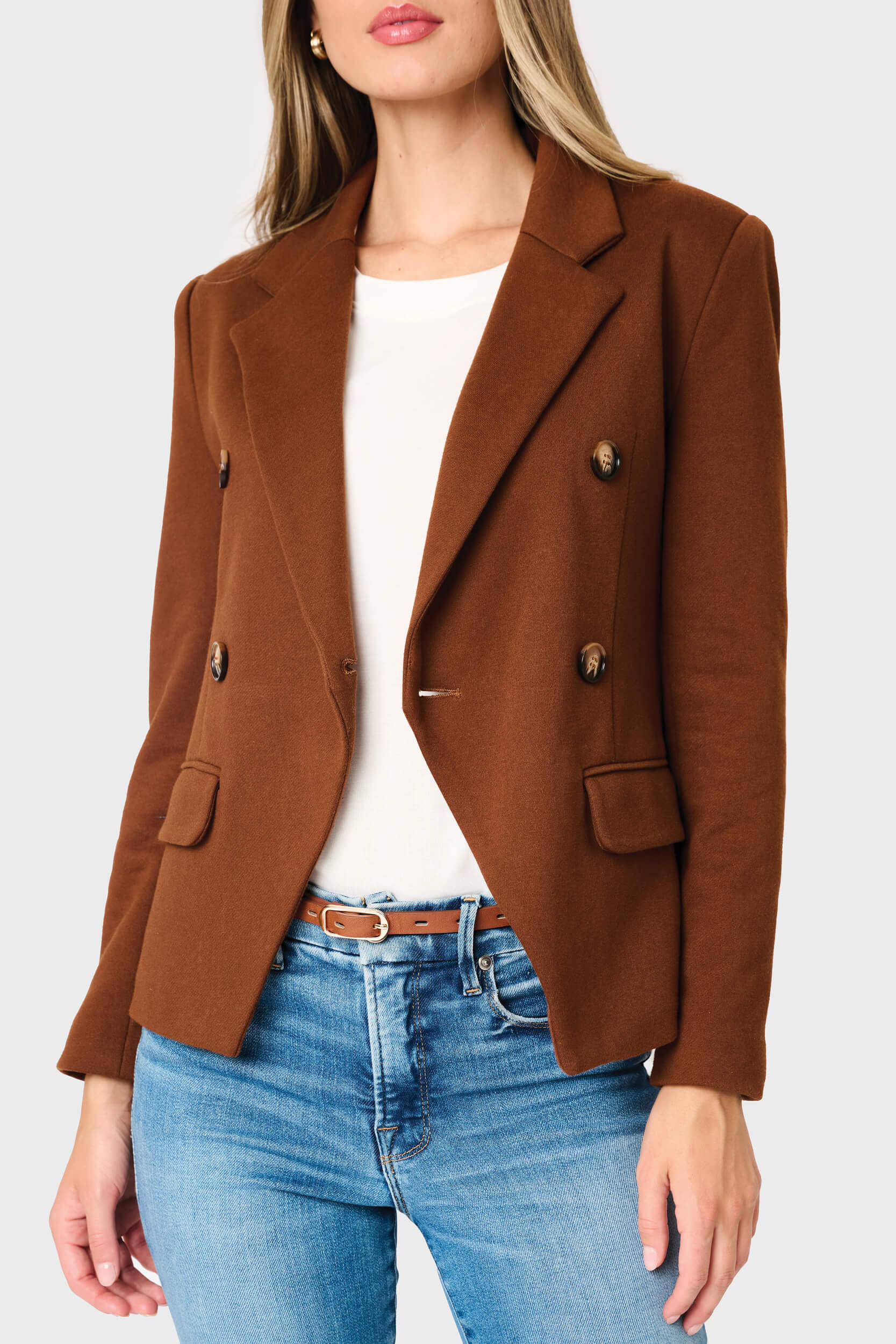 Woman modeling Double Breasted Blazer in Saddle brown styled business casual