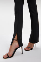 Close-up of women wearing the Good American Scuba Flare Pants