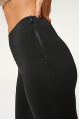 Close-up of women wearing the Good American Scuba Flare Pants