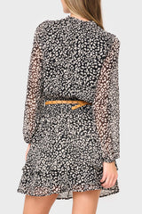 Back of Woman modeling Long Sleeve Isla Smocked Day Dress in Black Cheetah Print  styled for weekend date night