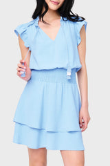 Woman modeling Isla Smocked Waist Flutter Day Dress in Vista Blue