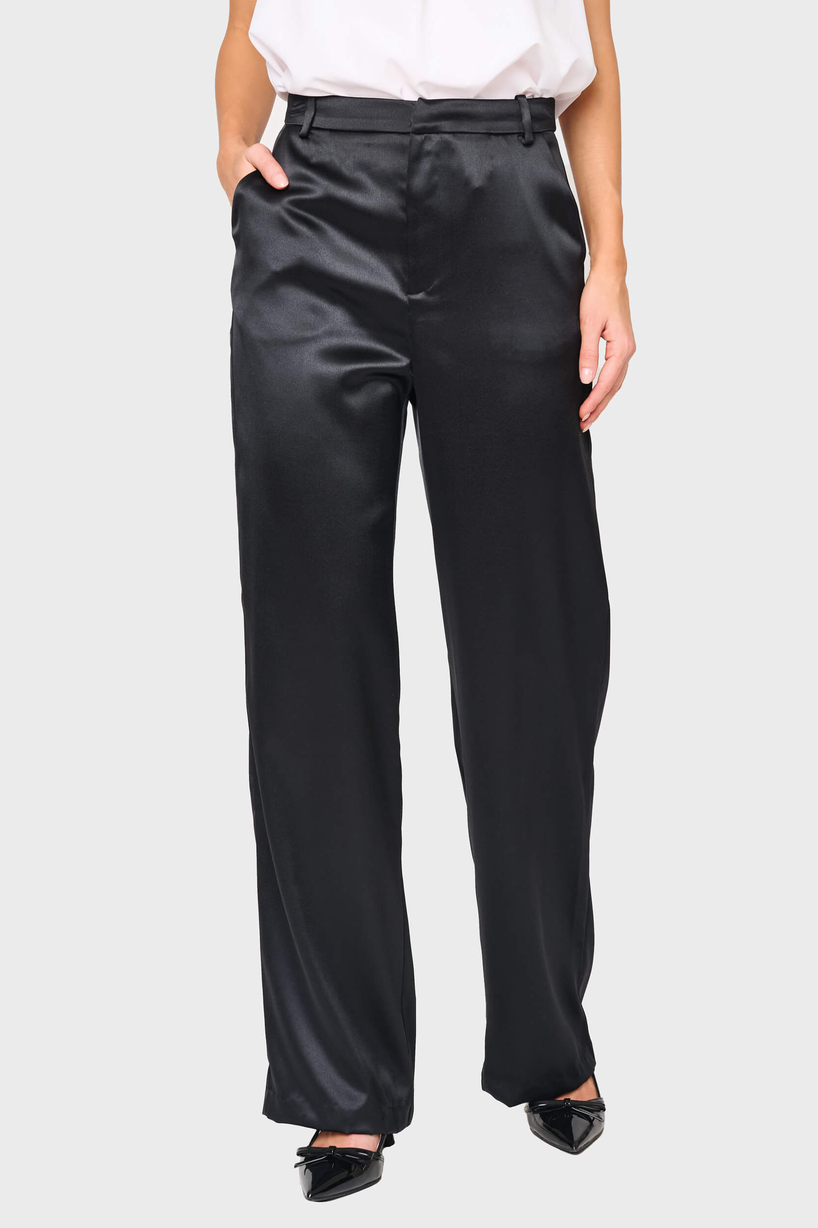Woman modeling Stovepipe Satin Trouser in Black, styled business casual for holiday events