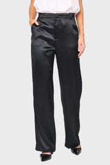Woman modeling Stovepipe Satin Trouser in Black, styled business casual for holiday events