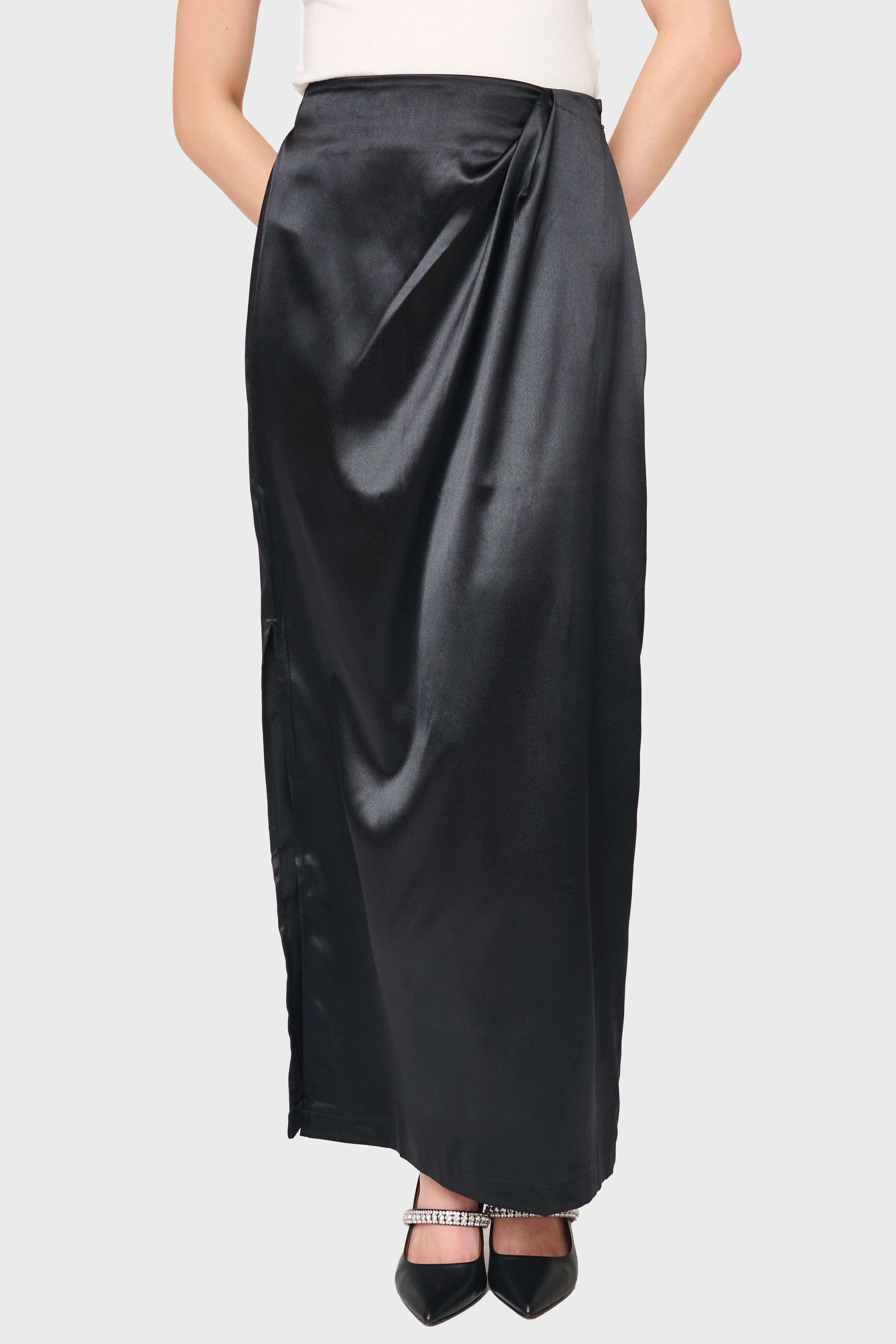 Woman modeling Satin Maxi Skirt With Pleat Details in Black styled business casual for holiday