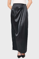 Woman modeling Satin Maxi Skirt With Pleat Details in Black styled business casual for holiday