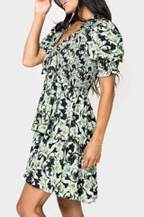 Side of women wearing the En Saison Istella Mini Dress forest navy