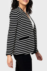 Side view of pockets woman modeling a Striped Notch Collar Blazer in black white stripe styled business casual