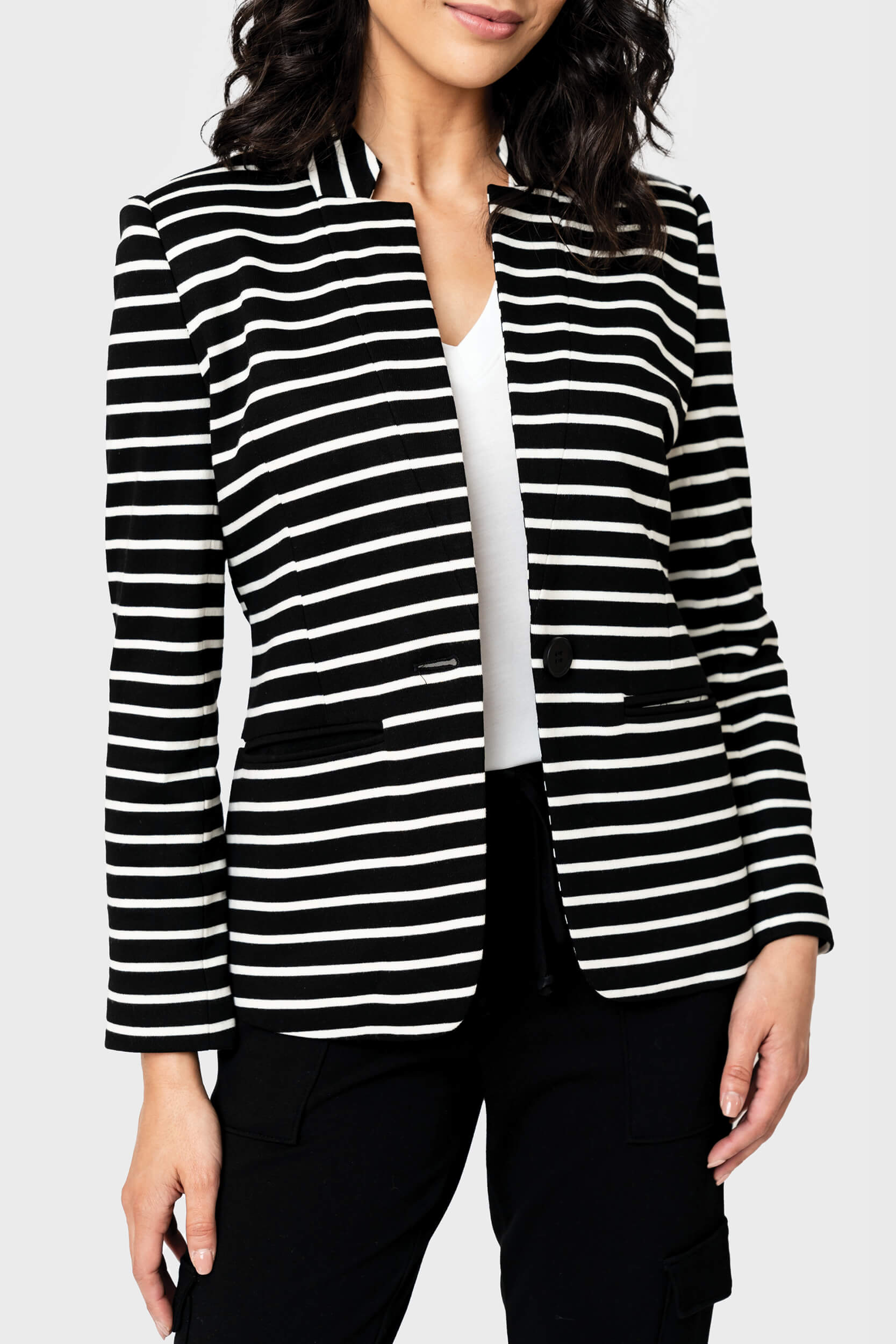 Woman modeling a Striped Notch Collar Blazer in black white stripe sweatshirt knit styled business casual
