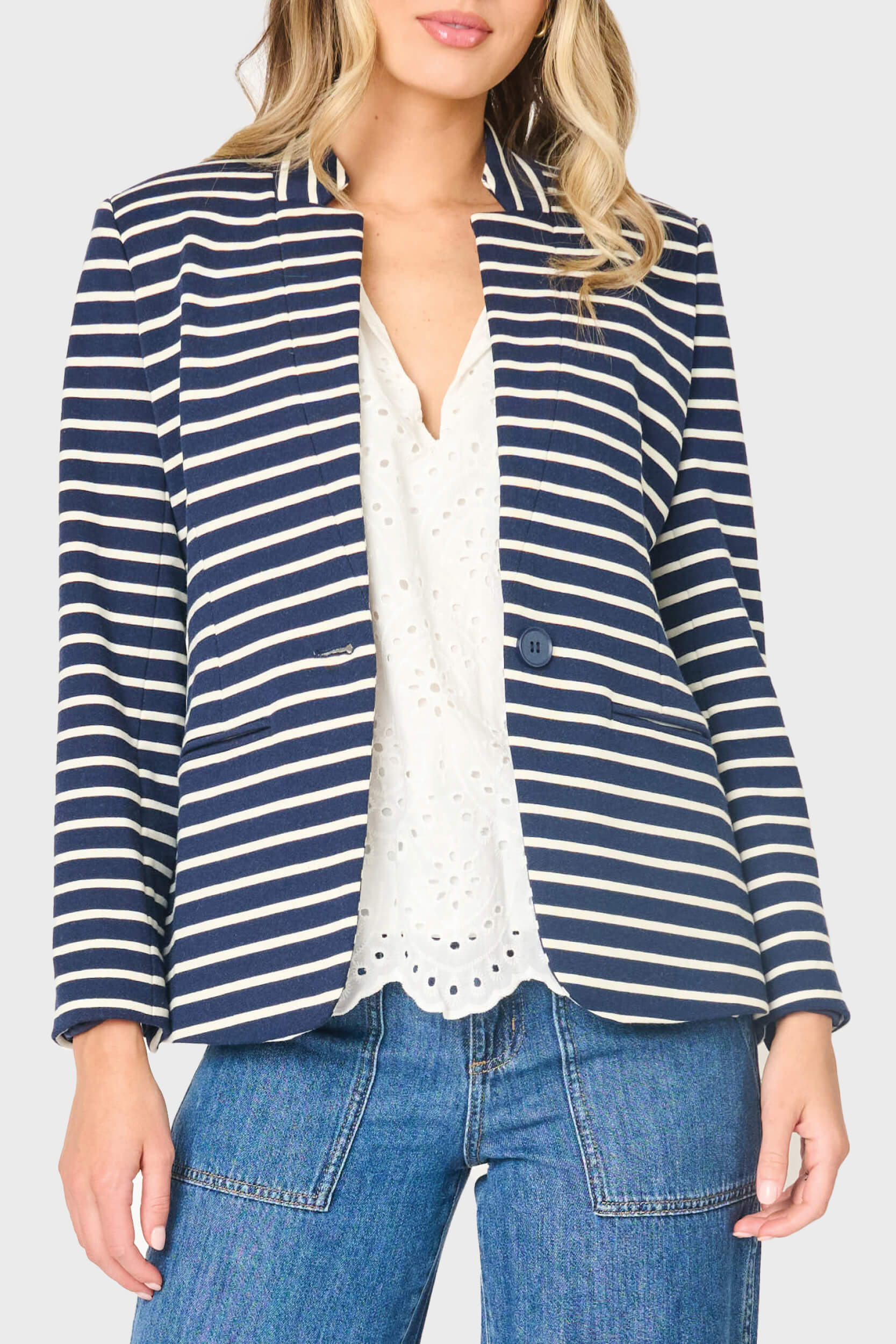 Woman modeling Striped Notch Collar Blazer in Navy Ivory Stripe styled for work and everyday wear