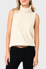 woman modeling Turtleneck Cable Stitch Sweater Vest in cream styled business casual for work