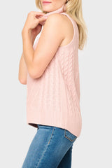 Side of Woman modeling Turtleneck Cable Stitch Sweater Vest in light pink smoke styled casual with denim