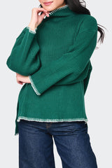 Woman modeling Funnel Neck Whipstitch Tunic Sweater in Green styled for fall holiday events