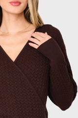 Brown cable knit sweater worn by a person on a white background