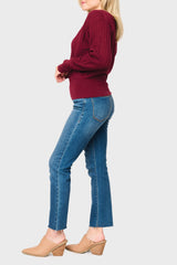 Side of Woman modeling Pointelle Surplice Sweater in Beet Red burgundy styled for everyday work and weekends
