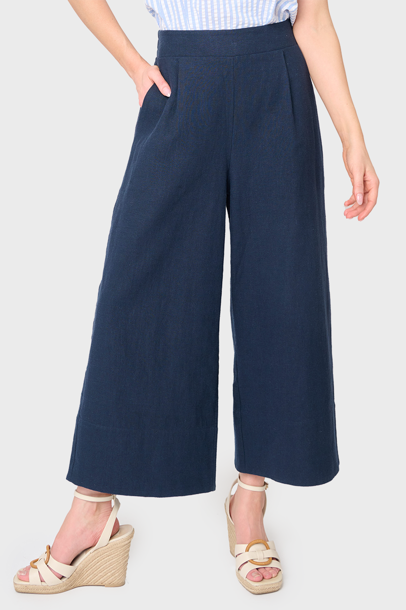 Woman modeling Wide Hem Cropped Linen Pant in Navy styled with blouse and sandals