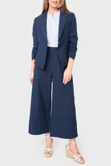 Full view of Woman modeling Wide Hem Cropped Linen Pant in Navy styled with blouse and matching jacket