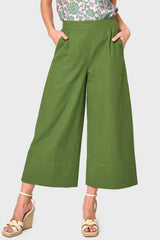 Woman modeling Wide Hem Cropped Linen Pant in Olive styled with blouse and sandals