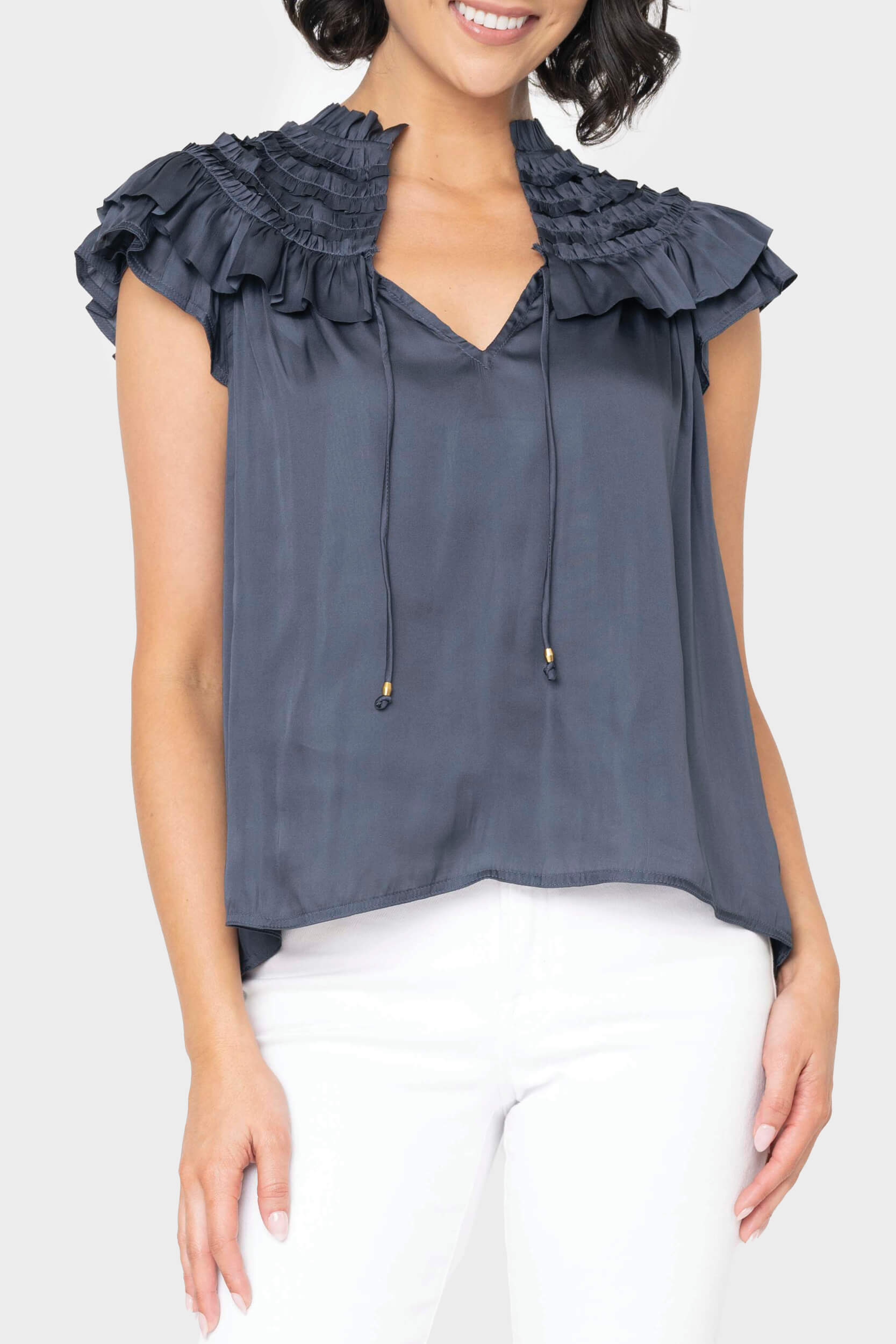 Front of women wearing the Reset By Jane Ruffled Yoke Crinkle Blouse in navy