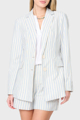 Woman modeling stripe linen blazer in blue ivory stripe styled as a set with matching shorts