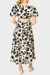 Back of women wearing the Moon River Floral Print Cut Out Shirred Midi Dress in ivory