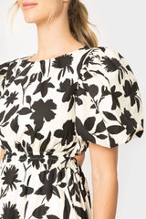 Close-up of women wearing the Moon River Floral Print Cut Out Shirred Midi Dress in ivory