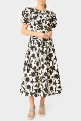 Front of women wearing the Moon River Floral Print Cut Out Shirred Midi Dress in ivory