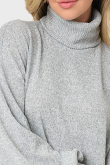 Detail of turtleneck sweater dress in heather grey