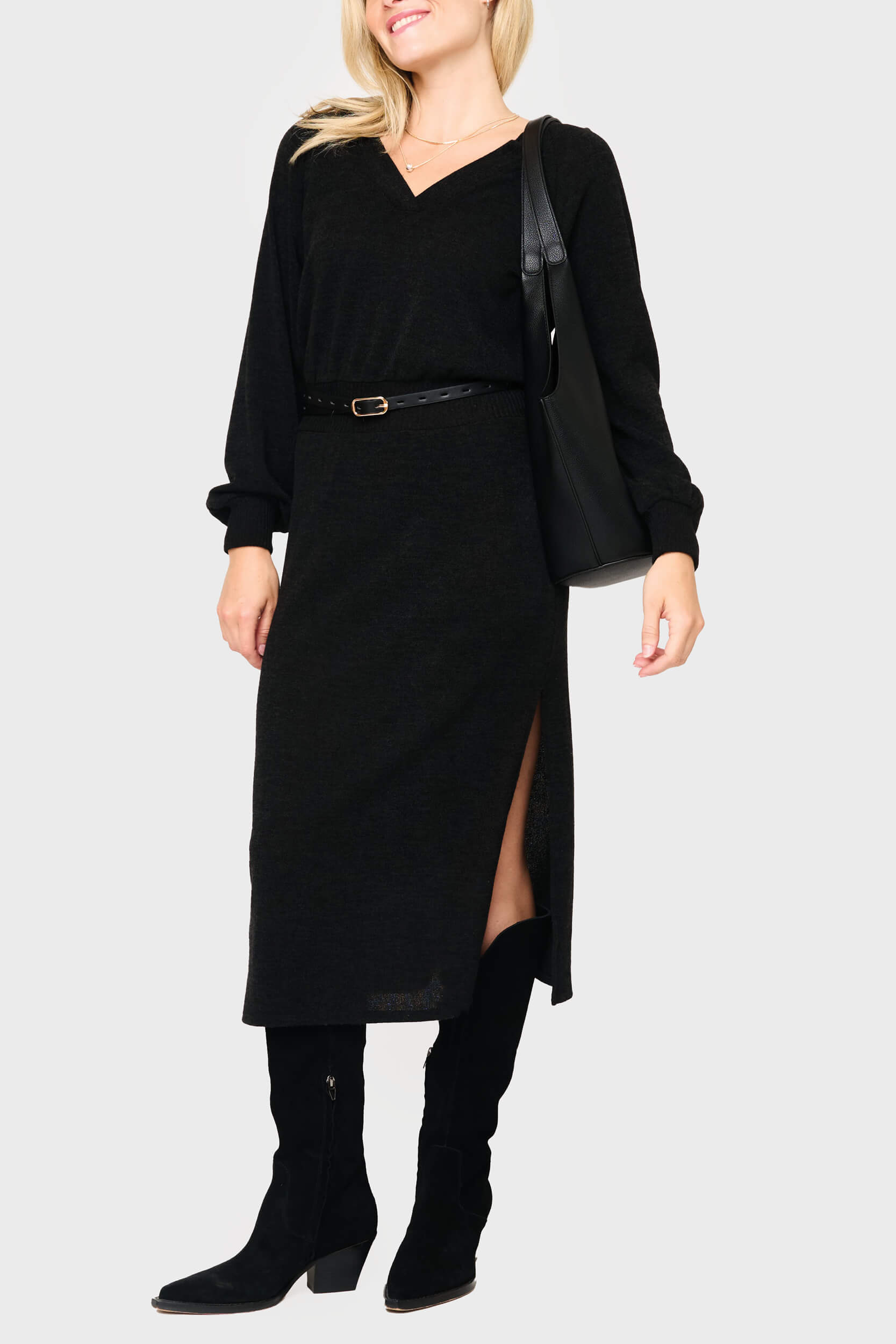 Woman modeling Long Sleeve V-Neck Midi Sweater Dress in Black styled business casual for work