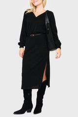 Woman modeling Long Sleeve V-Neck Midi Sweater Dress in Black styled business casual for work