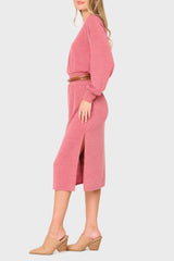 Side of Woman modeling Long Sleeve V-Neck Midi Sweater Dress in light mauve red with side slit