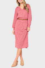 Woman modeling Long Sleeve V-Neck Midi Sweater Dress in light mauve red styled for work business casual