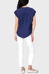 Back view of Woman modeling Cap Sleeve Notch Neck Blouse in Navy blue styled with casual pants